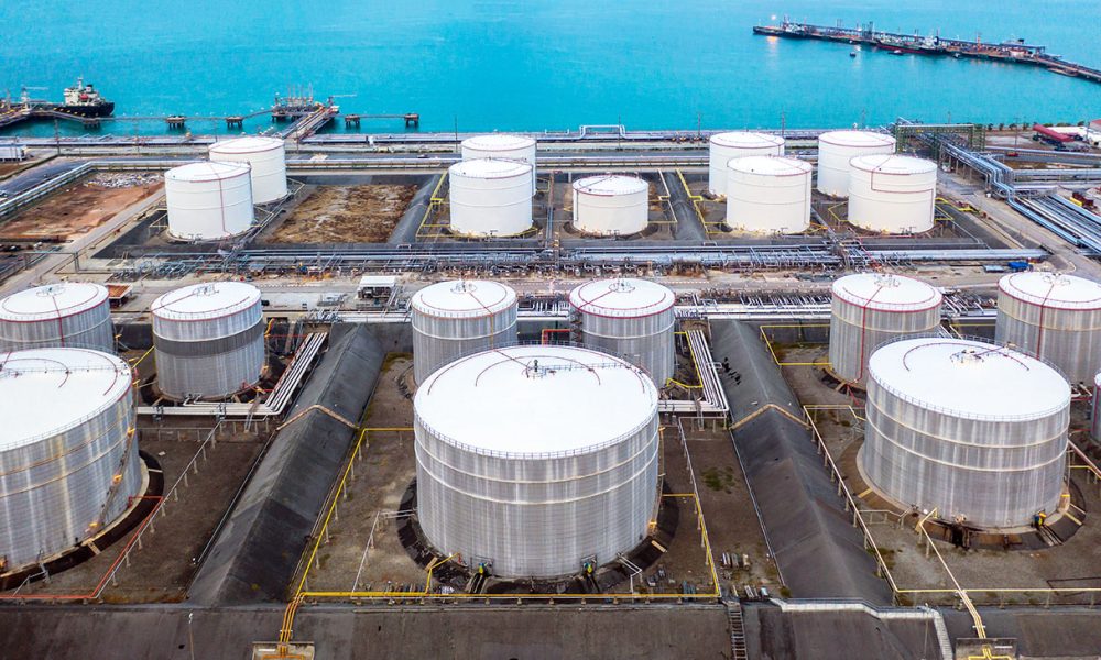 Oil and petrochemical tank, storage of oil and petrochemical products ready for logistic and transport business. Aerial view.